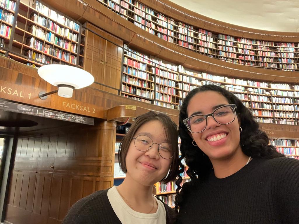 Jocelyn and her friend take a selfie inside the Stockholm City Library.